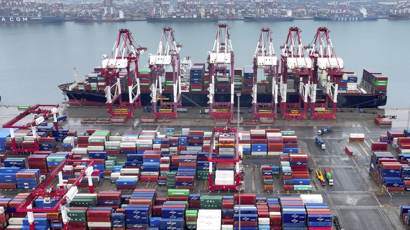 FILE - Cranes and transporters work at an automated container port in Qingdao in eastern China's Shandong province, on July 7, 2024. (Chinatopix via AP, File)