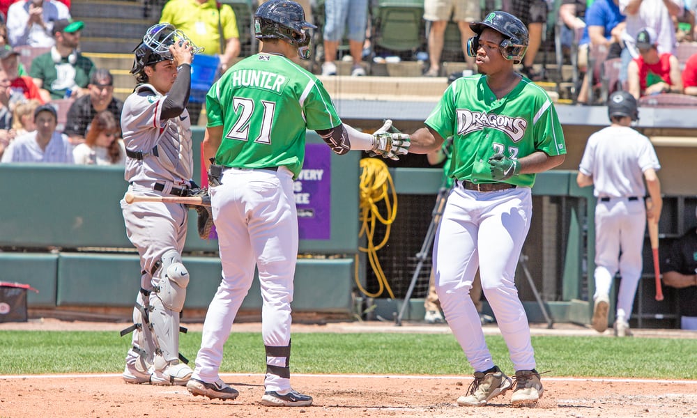 Cam Collier is greeted by Cade Hunter in the fourth inning Sunday at Day Air Ballpark after hitting his 10th home run. Jeff Gilbert/CONTRIBUTED