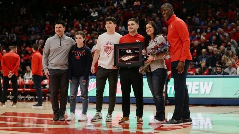 Dayton student manager Patrick Edwards is honored on Senior Day before a game against Davidson on Saturday, March 5, 2022, at UD Arena. David Jablonski/Staff