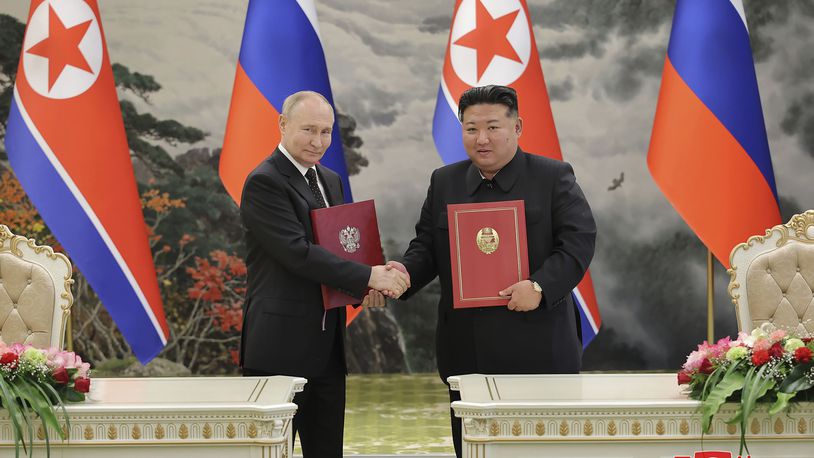 In this photo provided by the North Korean government, North Korean leader Kim Jong Un, right, and Russia's President Vladimir Putin shake hands after signing a comprehensive strategic partnership in Pyongyang, North Korea Wednesday, June 19, 2024. The content of this image is as provided and cannot be independently verified. Korean language watermark on image as provided by source reads: "KCNA" which is the abbreviation for Korean Central News Agency. (Korean Central News Agency/Korea News Service via AP)