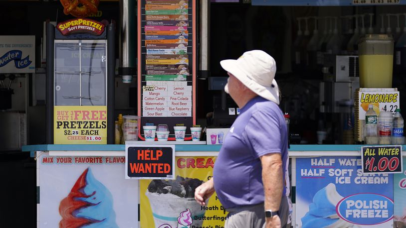 FILE - A person walks past an ice cream stand on the boardwalk, Thursday, June 2, 2022, in Ocean City, N.J. A type of bankruptcy protection filing that made it easier for small businesses to seek relief has expired, which will complicate filing for small businesses with more than $3 million in debt. (AP Photo/Matt Slocum, File)