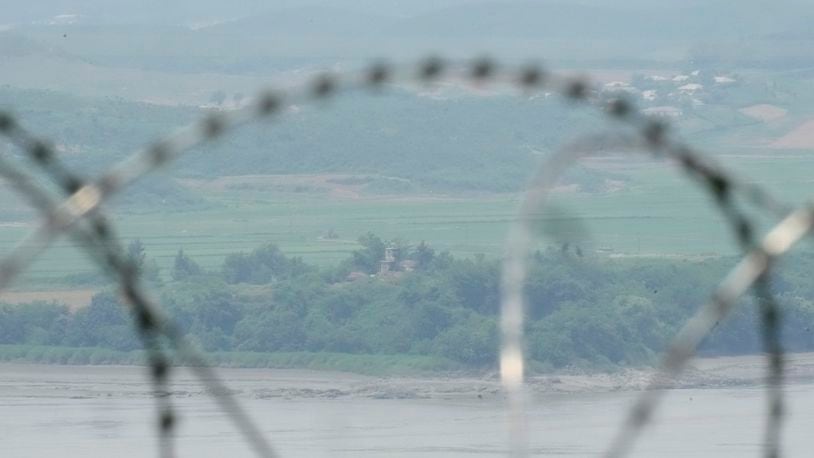 North Korea's military guard post is seen through the wire fences in Paju, South Korea, Friday, June 21, 2024. On Friday, South Korea’s military said it had fired warnings shots the previous day to repel several North Korean soldiers who briefly crossed the military demarcation line that divides the countries while engaging in unspecified construction work. Because of an overgrowth of foliage, the North Koreans may not have seen the signs marking the thin military demarcation line that divides the DMZ into northern and southern sides since the 1950-53 Korean War. (AP Photo/Lee Jin-man)