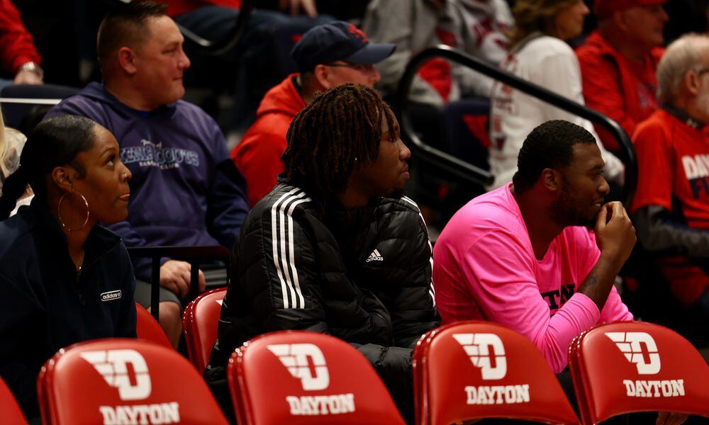Jaiun Simon, a 2023 recruit, watches from behind the Dayton bench during the Red & Blue Game on Saturday, Oct. 15, 2022, at UD Arena. David Jablonski/Staff