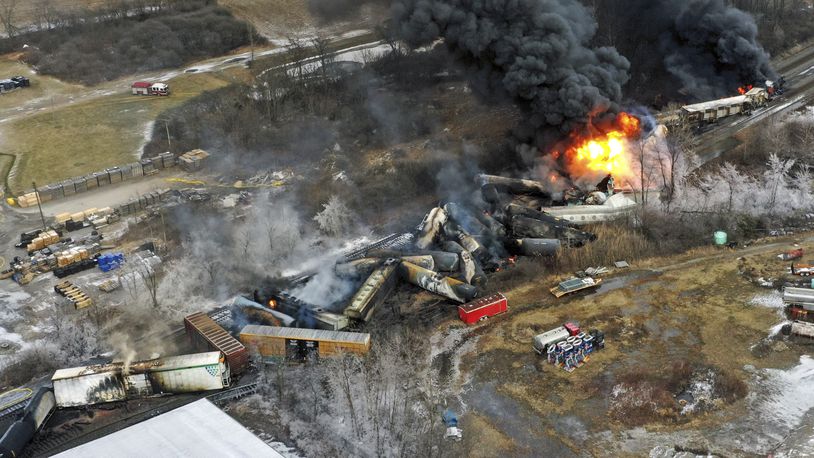 FILE - In this photo taken with a drone, portions of a Norfolk Southern freight train that derailed the previous night in East Palestine, Ohio, remain on fire at mid-day, Feb. 4, 2023. (AP Photo/Gene J. Puskar, File)