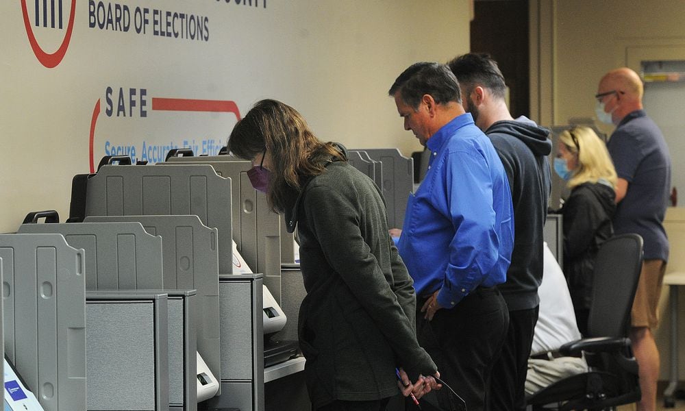 Voters at the Montgomery County Board of Elections Wednesday Oct. 12, 2022. Early voting started Wednesday in Ohio. Election officials expect a large turnout of early voters this year. MARSHALL GORBY\STAFF