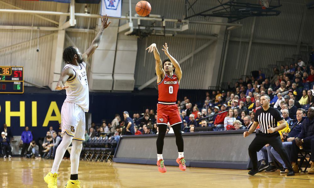 Dayton's Javon Bennett makes a 3-pointer in the second half against La Salle on Tuesday, Jan. 23, 2024, at Tom Gola Arena in Philadelphia. David Jablonski/Staff