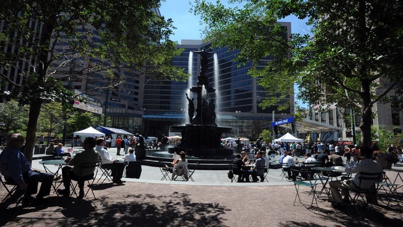 Hundreds of people eat, socialize and hold events during lunch hour on Fountain Square in Cincinnati. FILE