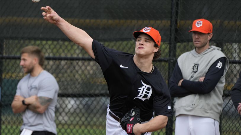 FILE - Detroit Tigers pitcher Jackson Jobe throws during a baseball spring training workout Feb. 16, 2024, in Lakeland, Fla. (AP Photo/Charlie Neibergall, File)