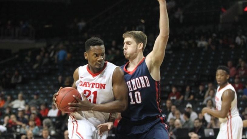 Dayton’s Dyhshawn Pierre drives to the basket past Richmond’s T.J. Cline in the first half. David Jablonski/Staff