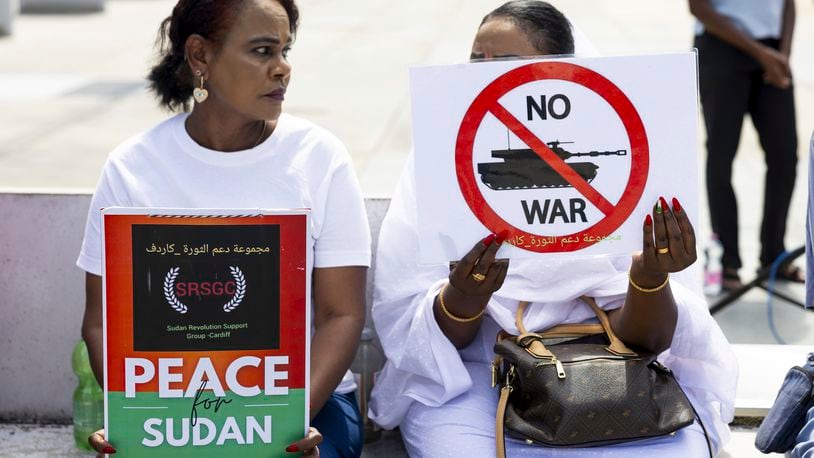 Demonstrators hold signs during a rally, on the opening day of peace talks for Sudan, at the Place des Nations in front of the European headquarters of the United Nations in Geneva, Switzerland, Wednesday, Aug. 14, 2024. (Salvatore Di Nolfi/Keystone via AP)