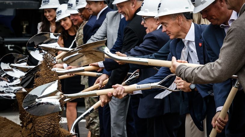 Sierra Nevada Corp. celebrated the opening of it's new 100,000-square-foot aircraft maintenance hanger and the groundbreaking of two other slightly larger hangers that will be built near the Dayton International Airport.  JIM NOELKER/STAFF