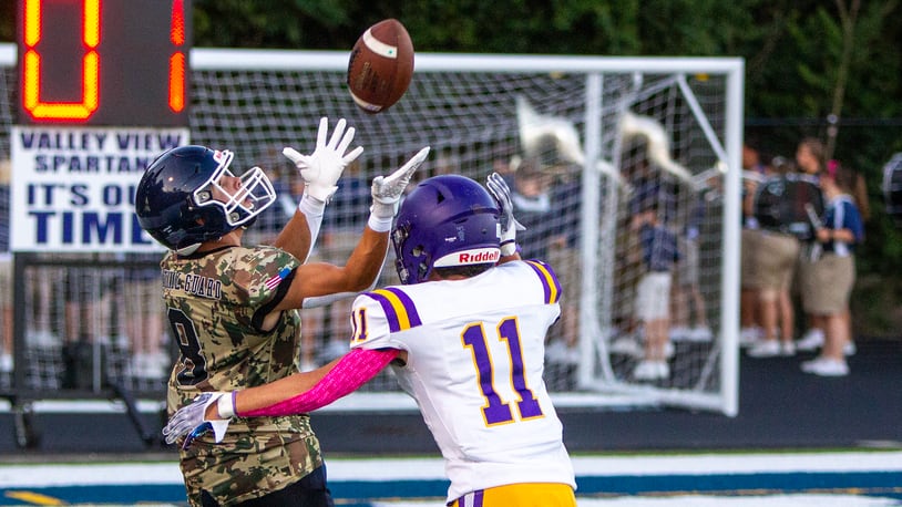 Valley View's Caleb Musgrove catches a 42-yard pass over Bellbrook's Jeaden Wheatly during the first half Friday night at Niswonger Field. Jeff Gilbert/CONTRIBUTED