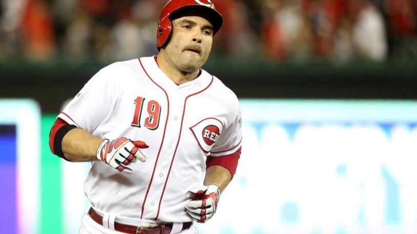 Votto traded his jersey for a Reds fan's shirt