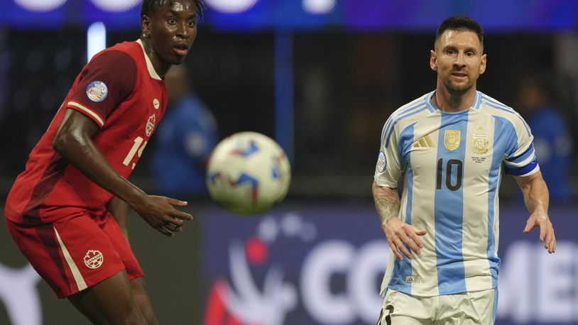Argentina's Lionel Messi, right, and Canada's Moïse Bombito watch the ball during a Copa America Group A soccer match in Atlanta, Thursday, June 20, 2024. (AP Photo/Jason Allen)