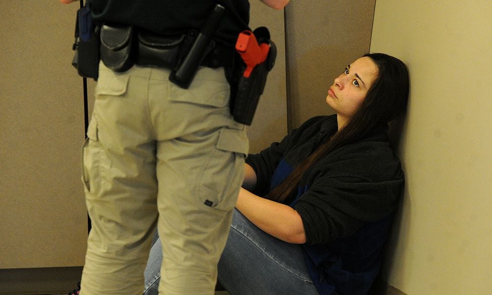 Deputy Keri Benoit of the Butler County Sheriffs Office is an actor for the Sinclair Police Academy's crisis intervention practicals, helping cadets learn how to talk down people in mental health crisis. MARSHALL GORBY/STAFF