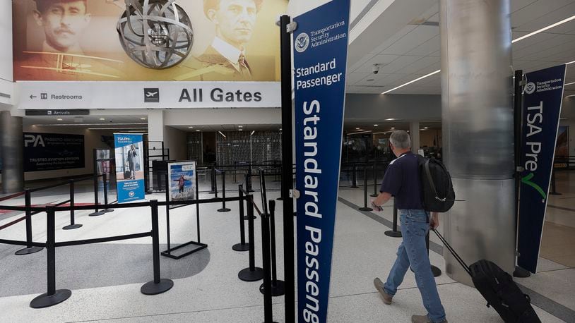 Travelers walk through Dayton International Airport Thursday, June 27, 2024. The airport will be busy for Independence Day week as travel nationwide is expected to be 5% greater than in 2023 and 8% greater than 2019. MARSHALL GORBY/STAFF