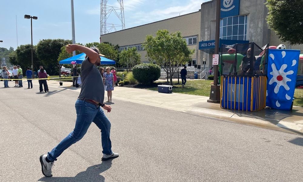 Dayton electric utility AES Ohio and the United Way celebrated an enduring partnership Wednesday. Among the fun activities: a dunking booth on the parking lot of AES Ohio's Dryden Road operations center. THOMAS GNAU/STAFF