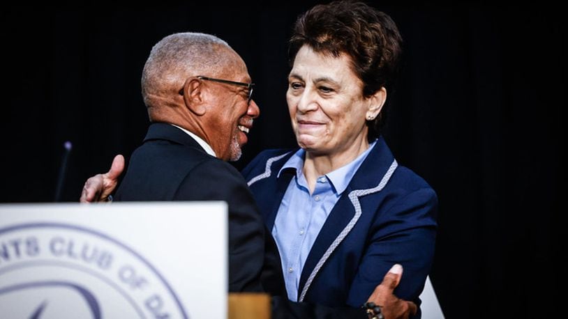 Retired Air Force office Cassie Barlow is congratulated Thursday, Oct. 5, 2023 by Dayton Mayor Jeffrey Mims Jr. for being named the Citizen Legion of Honor award winner for 2023.