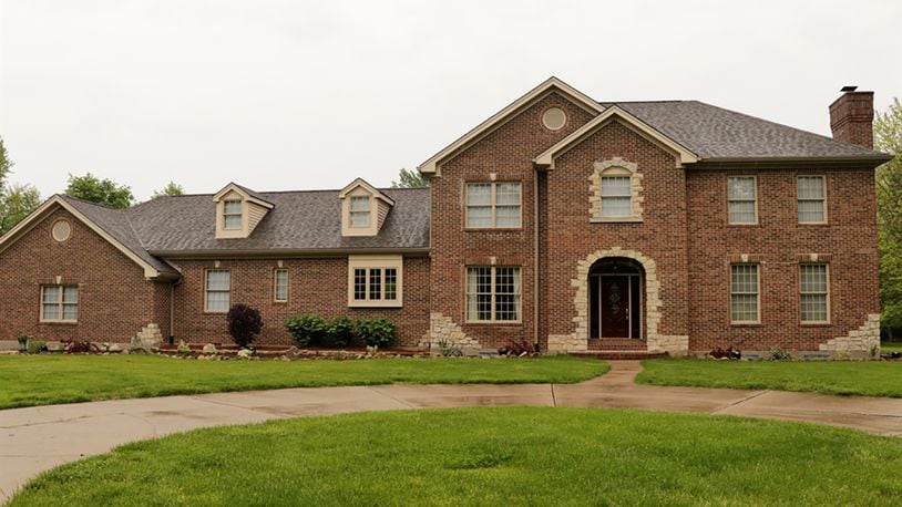 The 2-story has about 5,240 sq. ft. of living space plus a finished basement. A side-entry, 3-car garage is hidden by a brick accent wall. The home sits on sits on 3.62 acres within the Hampton Farms Estates of Washington Twp. CONTRIBUTED PHOTO BY KATHY TYLER