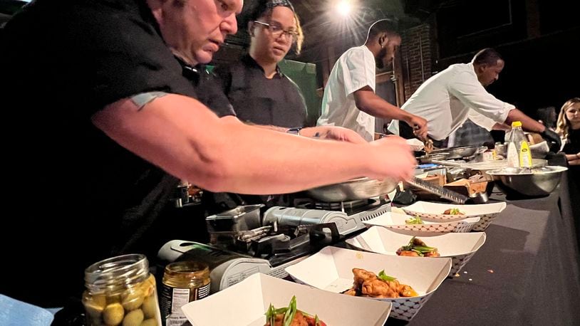 The final round of the Diced in Dayton Chef's Challenge saw the team from Corner Kitchen led by executive chef Gavin St. Denis (far left), face off agains the team from Rich Taste Catering led by chef and owner Gerald Richardson (far right).