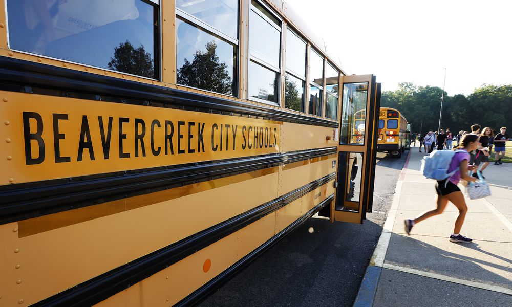 Students arrive Wednesday, Aug. 14, 2024 for the first day of school at Beavercreek High School. MARSHALL GORBY\STAFF