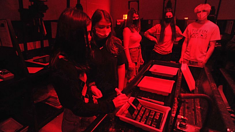 Beavercreek High School students work in a photo darkroom on Oct. 8, 2020.