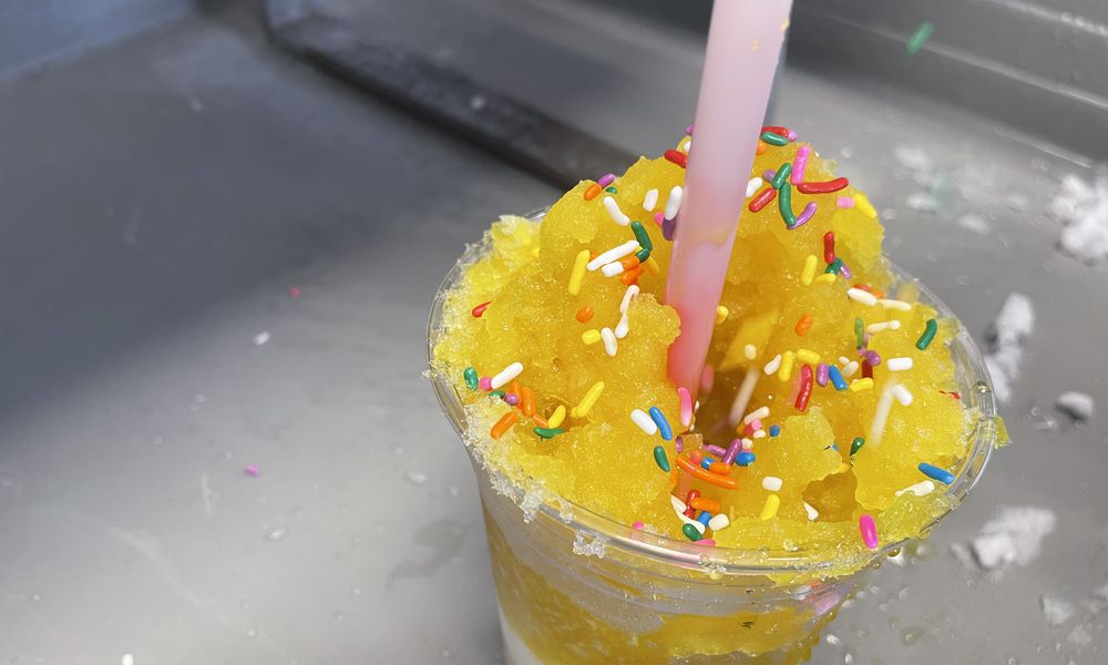 Ducky’s Snowballs and Ice Cream is located at 100 W. Market St. in Troy. Owner Donald Butler makes a stuffed snowball. NATALIE JONES/STAFF