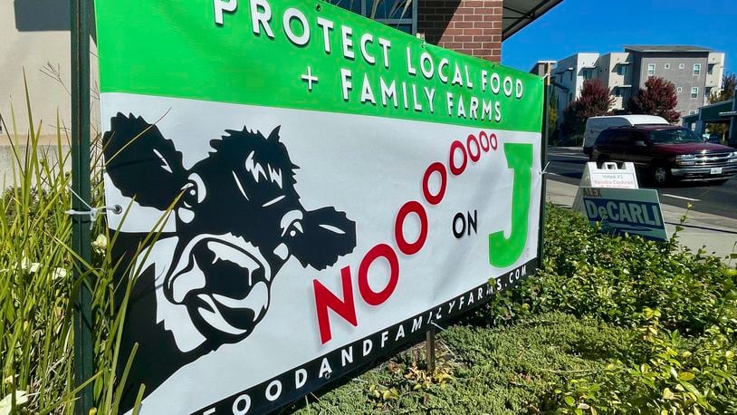 A sign outside a business urges voters to reject Measure J, which would phase out large-scale animal farms in Sonoma County, Thursday, Sept. 19, 2024, in Petaluma, Calif. (AP Photo/Haven Daley)