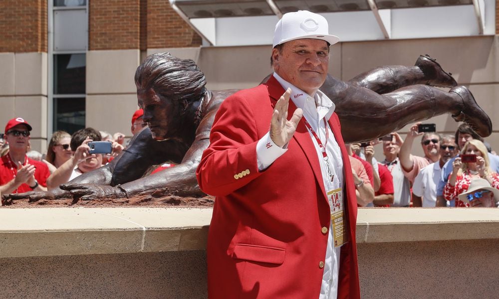 Former Cincinnati Reds player Pete Rose smiles as he stands for pictures during the dedication of his statue outside Great American Ballpark prior to a baseball game between the Cincinnati Reds and the Los Angeles Dodgers, Saturday, June 17, 2017, in Cincinnati. (AP Photo/John Minchillo)