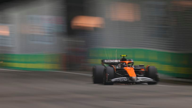 McLaren driver Lando Norris of Britain steers his car during the qualifying session of the Singapore Formula One Grand Prix at the Marina Bay Street Circuit, in Singapore, Saturday, Sept. 21, 2024. (AP Photo/Vincent Thian)