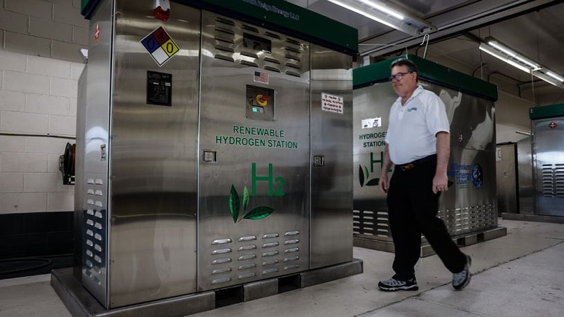 Founder and CEO of Millennium Reign Energy walks by a Renewable Hydrogen Station that is company builds on North Main Street in Dayton Friday July 19, 2024. JIM NOELKER/STAFF