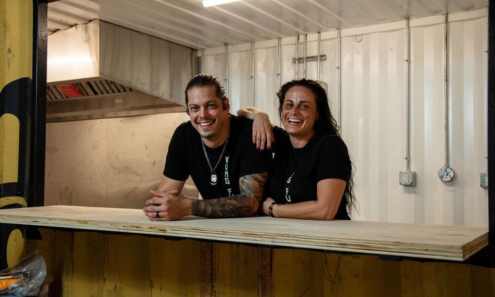 KungFu BBQ will serve worldly-inspired cuisine with a unique smoked interpretation at The Silos, a new food hall and beer garden expected to open in the fall near 2nd Street Market in downtown Dayton. Pictured are owners Nate and Marie Lansangan (CONTRIBUTED PHOTO).