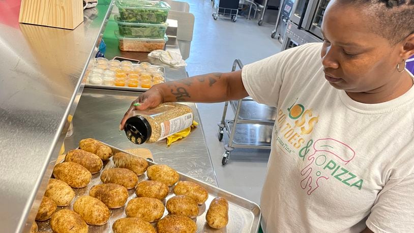 Dayton native Martina Scott, owner of Boss Potatoes, has quadrupled her customer base since she started cooking from her home almost four years ago. On Wednesday, Aug. 7 she started her first day as a member of 6888 Kitchen Incubator at the Dayton Arcade. NATALIE JONES/STAFF