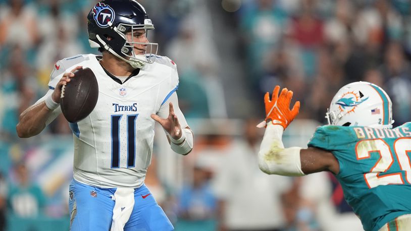 Tennessee Titans quarterback Mason Rudolph (11) aims a pass during the second half of an NFL football game against the Miami Dolphins, Monday, Sept. 30, 2024, in Miami Gardens, Fla. (AP Photo/Rebecca Blackwell)