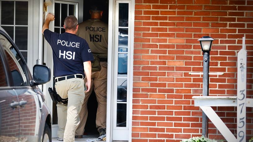 Homeland security, searching a home at 3759 Woodbury Dr., Friday, July 26, 2024. MARSHALL GORBY \STAFF