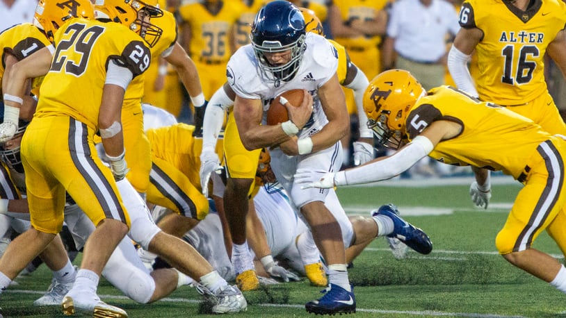 Fairmont's Logan Doty rushes for some of the 91 yards he gained on 26 carries in Thursday night's 24-7 win over Alter. Doty scored three 1-yard touchdowns. Jeff Gilbert/CONTRIBUTED