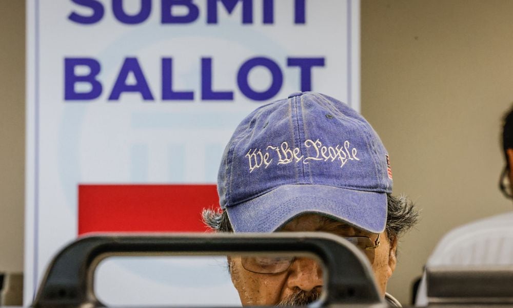 Dr. Juan Gotos from Centerville votes early at the Montgomery County Board of Elections Tuesday October 8, 2024. Jim Noelker/Staff