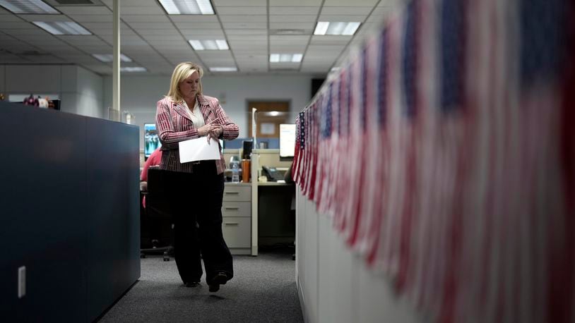 Cari-Ann Burgess, interim registrar of voters for Washoe County, Nev., walks through the office Sept. 20, 2024, in Reno, Nev. (AP Photo/John Locher)