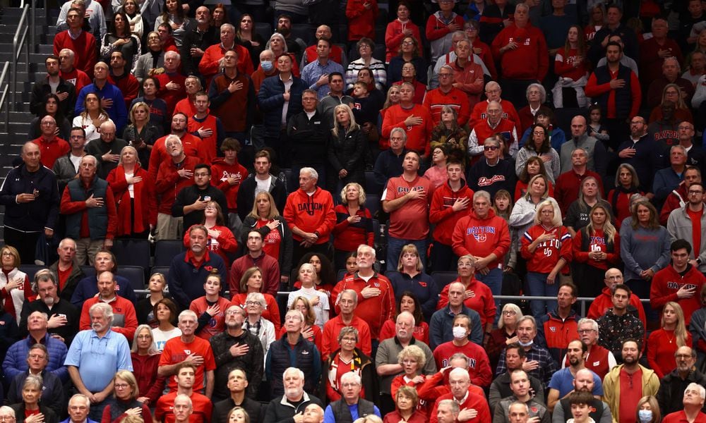 Dayton fans stand for the national anthem before a game against Western Michigan on Wednesday, Nov. 30, 2022, at UD Arena. David Jablonski/Staff