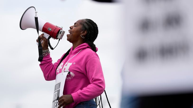 Striking longshoreman Teresa Whitte, of New York, pickets outside the Packer Avenue Marine Terminal Port, Tuesday, Oct. 1, 2024, in Philadelphia. (AP Photo/Matt Slocum)