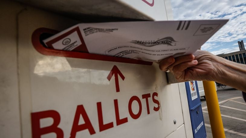 In this file photo from 2023 a Montgomery County voter drops off her ballot in the secure ballot drop box outside the Montgomery County Board of Elections. Jim Noelker/Staff