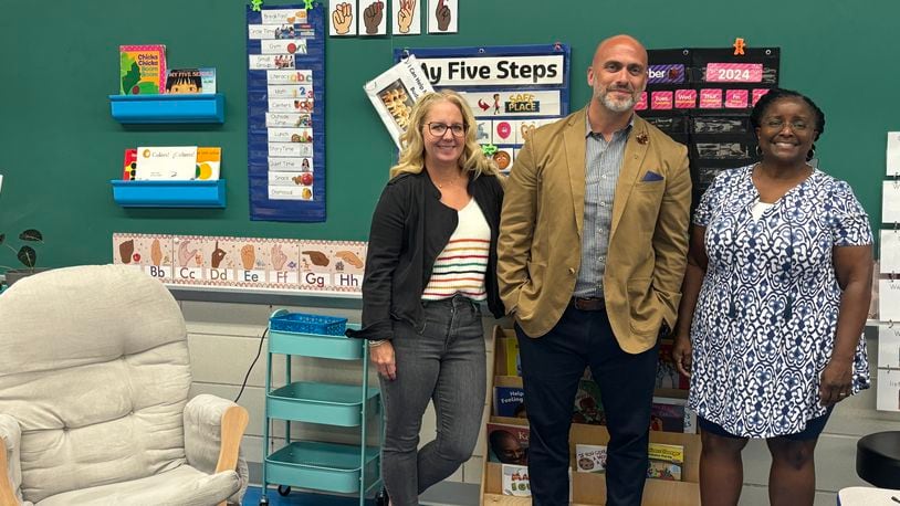 Newcomer classroom teacher Julie Emmons, left, stands with principal of the Montgomery County Educational Service Center preschool Nate Warner and assistant preschool teacher Sherri Bolden in the Newcomer preschool classroom for refugee students. Eileen McClory / staff