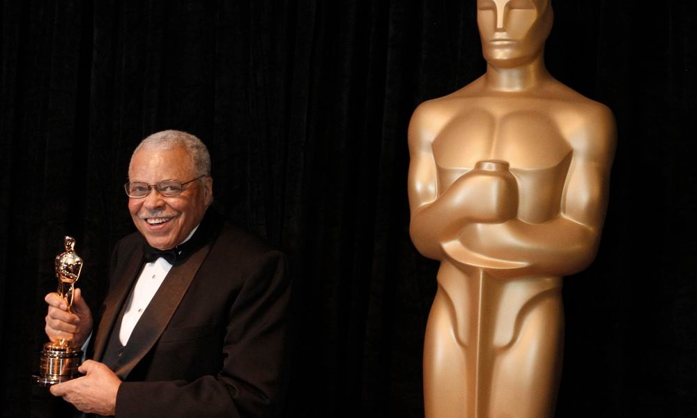 FILE - James Earl Jones poses with his honorary Oscar at the 84th Academy Awards on Sunday, Feb. 26, 2012, in the Hollywood section of Los Angeles. Jones, who overcame racial prejudice and a severe stutter to become a celebrated icon of stage and screen has died at age 93, Monday, Sept. 9, 2024. (AP Photo/Chris Carlson, File)