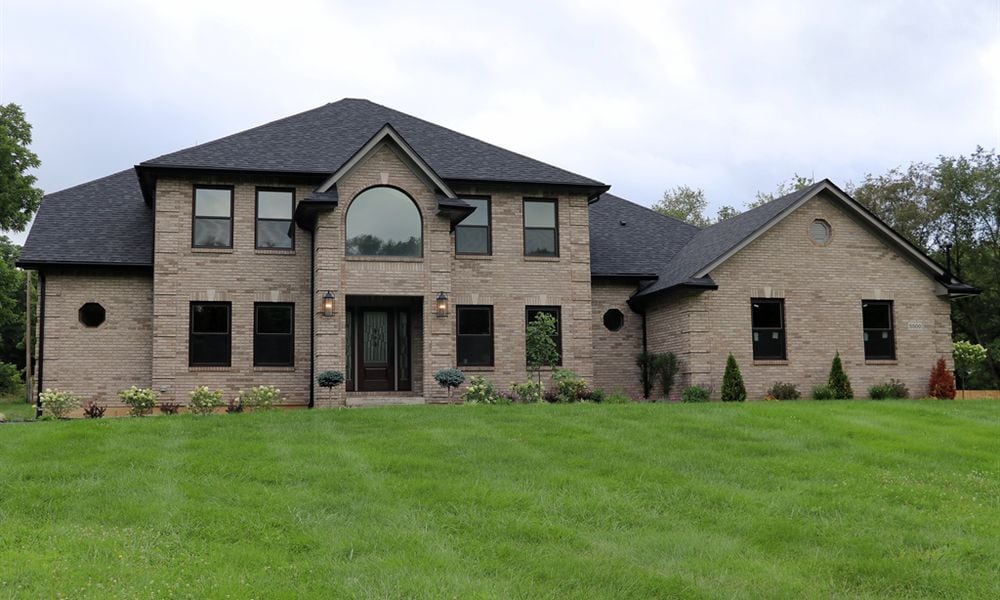 Located within a pocket cul-de-sac along the Stillwater River banks, the brick two-story at 5500 Beejay Court has about 4,892 square feet of living space including the finished walk-out basement. Listed for $750,000 by Home Experts Realty, the secluded 1.2-acre property has a tree-lined and wood privacy-fenced back yard and includes a new storage barn with covered porch. CONTRIBUTED