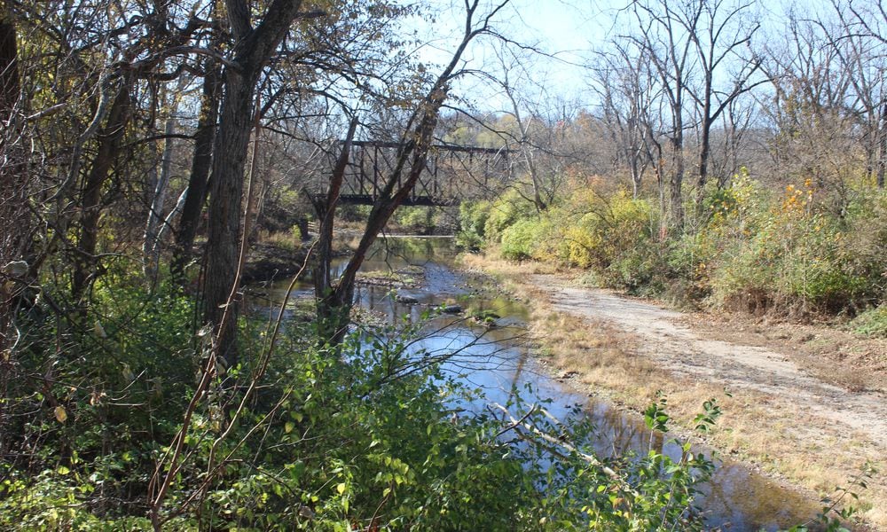 Wolf Creek near Wesleyan MetroPark in northwest Dayton. Dayton is seeking a company to complete a stream restoration project for the creek. CORNELIUS FROLIK / STAFF