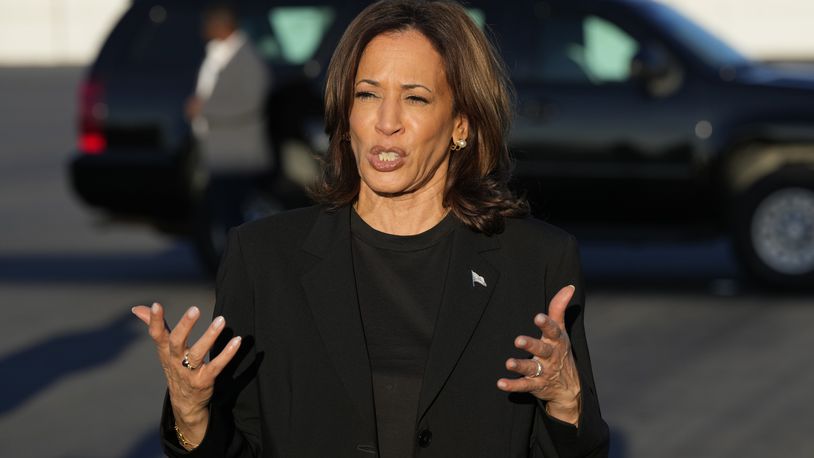 Democratic presidential nominee Vice President Kamala Harris speaks to reporters before boarding Air Force Two at Charlotte Douglas International Airport, Saturday, October 5, 2024, in Charlotte, N.C., after a briefing on the damage from Hurricane Helene. (AP Photo/Chris Carlson)