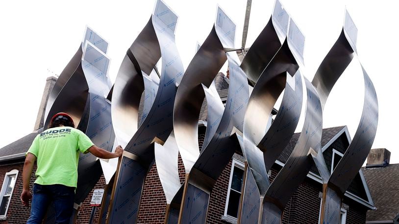 The Seed of Life sculpture for the Oregon District shooting memorial was craned in Thursday, July 25, 2024. MARSHALL GORBY\STAFF