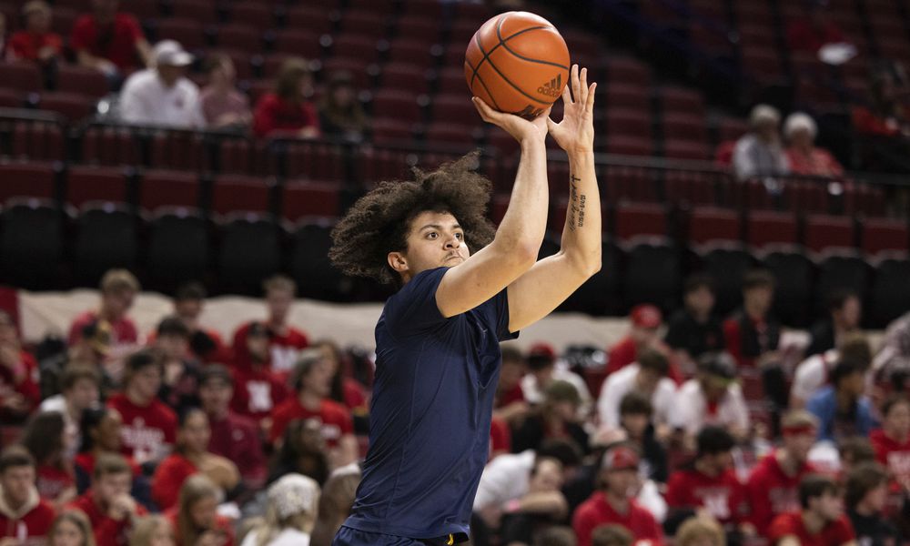 Michigan's George Washington III shoots while warming up before playing against Nebraska in an NCAA college basketball game Saturday, Feb. 10, 2024, in Lincoln, Neb. (AP Photo/Rebecca S. Gratz)