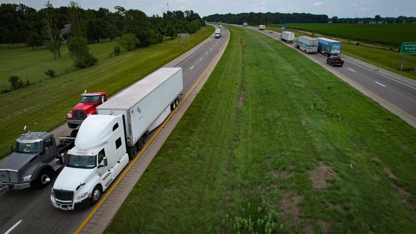 Semi trucks move east and west on Interstate 70 near the Arlington Road exit Wednesday, July 26, 2023. Ohio has agreed to test partially automated trucks on Interstate 70 in the Dayton area. Jim Noelker/Staff
