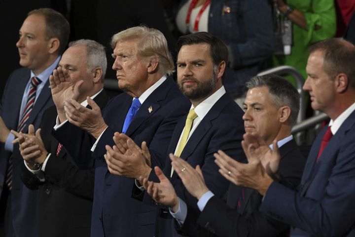 
                        Former President Donald Trump and Sen. JD Vance (R-Ohio), the Republican vice presidential nominee, applaud during the second night of the Republican National Convention at the Fiserv Forum in Milwaukee, Wis., on Tuesday, July 16, 2024. Crime and immigration were the focus of speeches on the second day of the Republican National Convention. (Kenny Holston/The New York Times)
                      